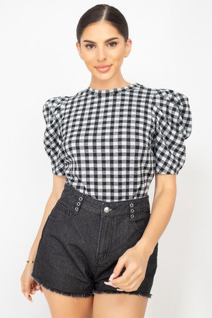 Knit Top featuring a Black and White Checkered pattern,